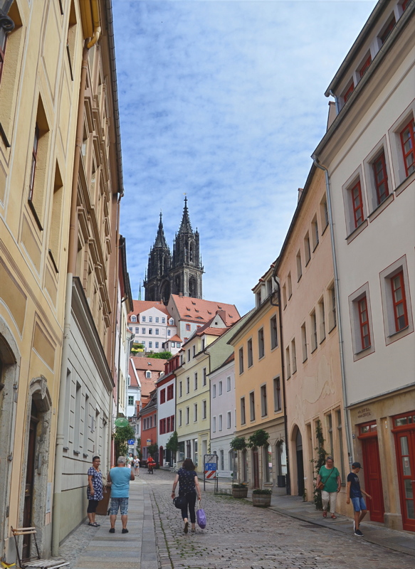 9 - Burgstraße in the historic old town of Meißen, Saxony, featuring the twin spires of the Meißen Cathedral looming over the traditional cobblestone street
